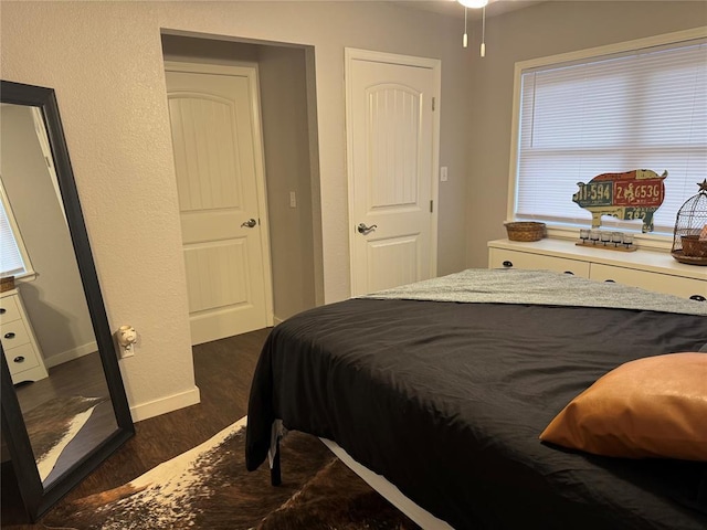 bedroom featuring dark hardwood / wood-style floors