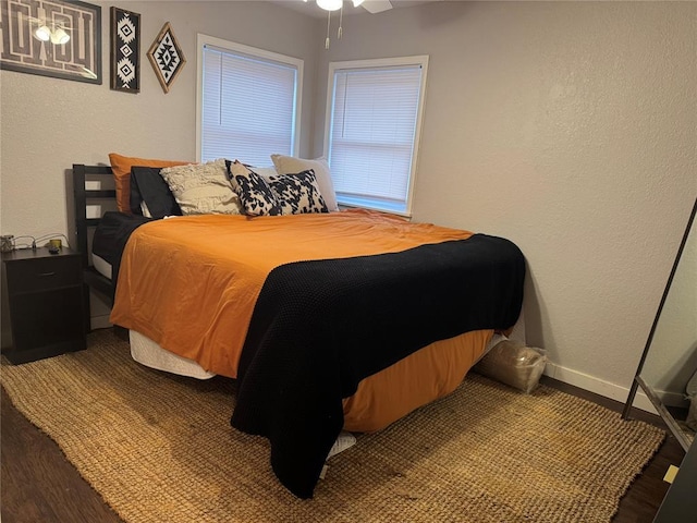 bedroom featuring hardwood / wood-style floors and ceiling fan