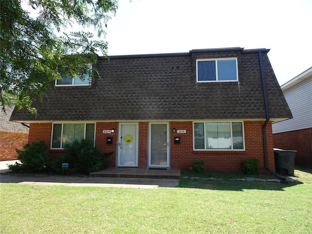 view of front of home featuring a front yard