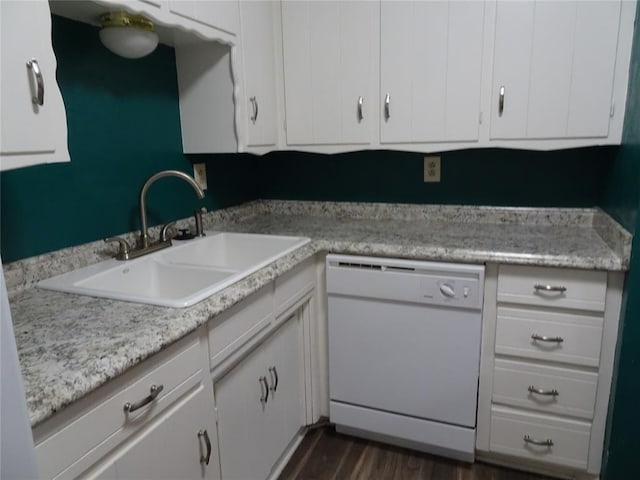 kitchen with white cabinetry, white dishwasher, dark hardwood / wood-style flooring, and sink