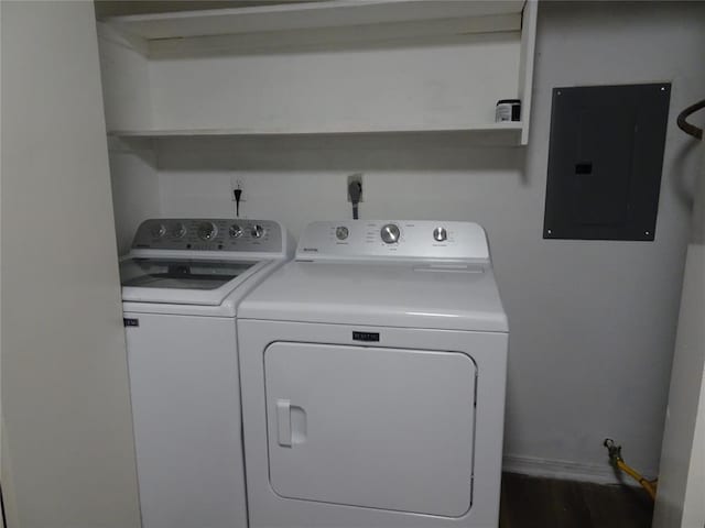 clothes washing area featuring separate washer and dryer and electric panel