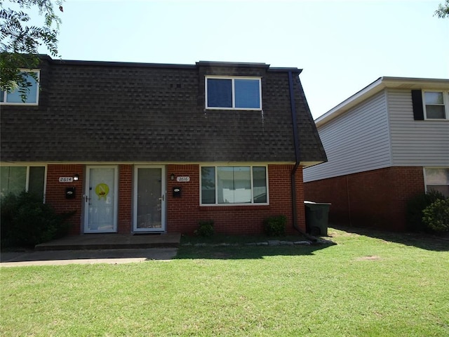 view of front of home with a front yard