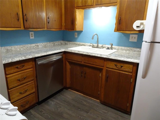 kitchen featuring white fridge, sink, stainless steel dishwasher, and dark hardwood / wood-style floors