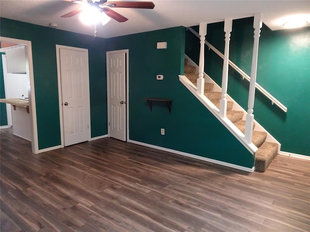 interior space with dark hardwood / wood-style floors and ceiling fan