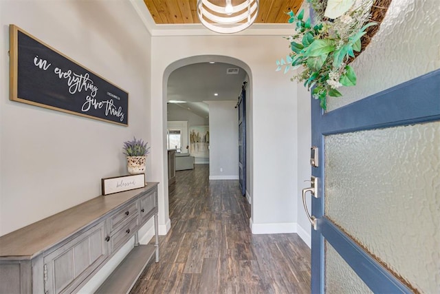 hallway with dark hardwood / wood-style flooring and wooden ceiling