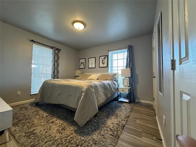 bedroom with hardwood / wood-style floors