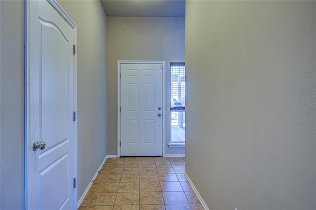 entryway featuring light tile patterned floors