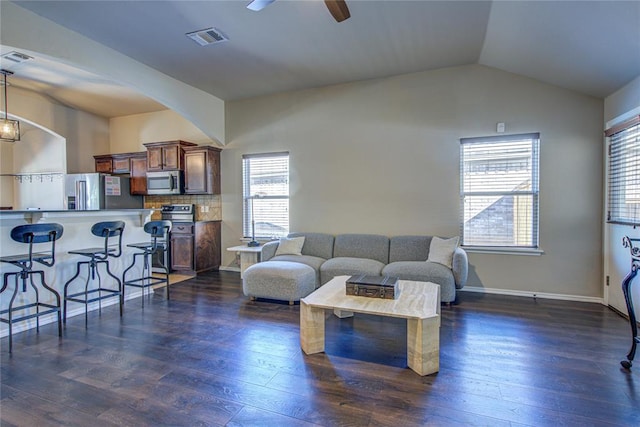 living room with lofted ceiling, dark wood-type flooring, and ceiling fan