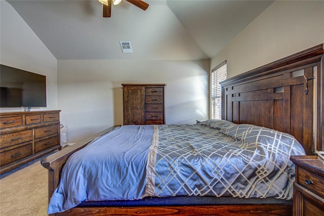 bedroom featuring lofted ceiling, ceiling fan, and carpet flooring