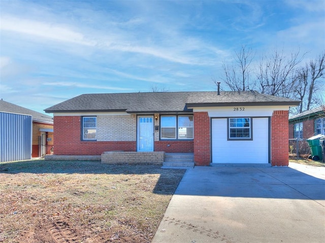 ranch-style home with a garage and a front lawn