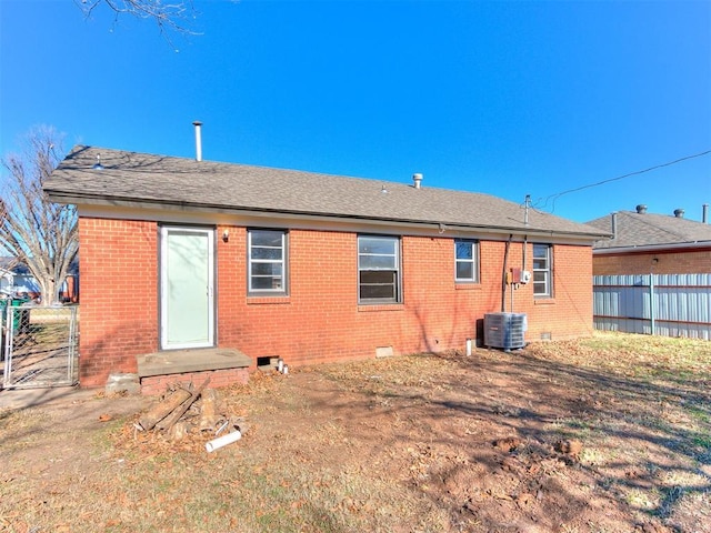 rear view of house featuring cooling unit