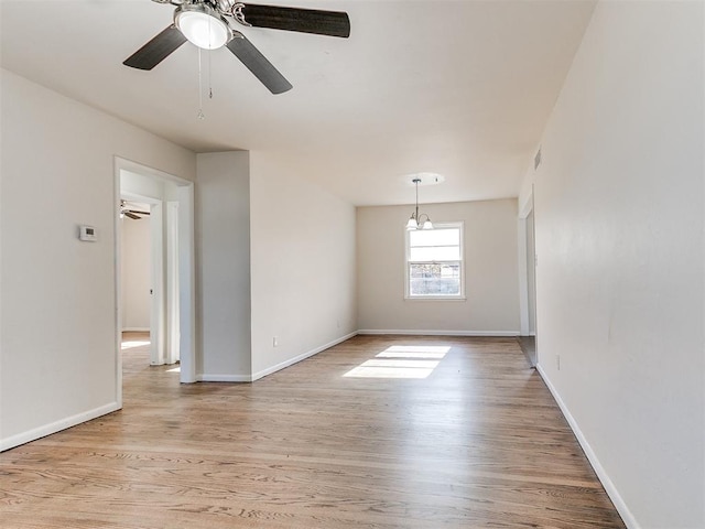 empty room with light hardwood / wood-style floors and ceiling fan