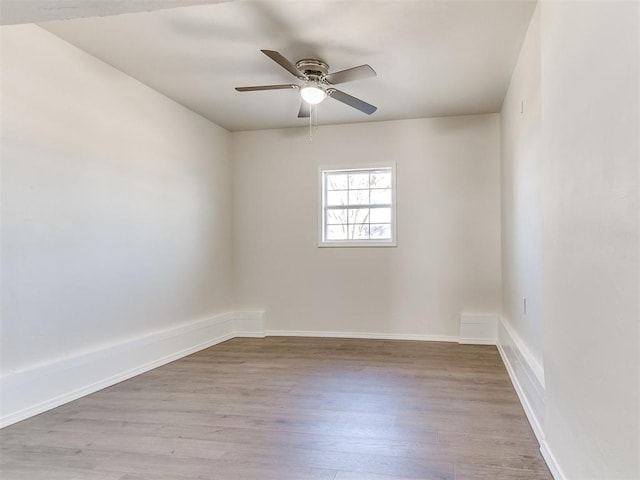 unfurnished room featuring light hardwood / wood-style floors and ceiling fan