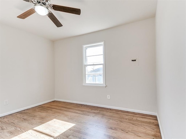 spare room featuring ceiling fan and light wood-type flooring