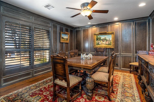 dining room with dark hardwood / wood-style flooring and ceiling fan