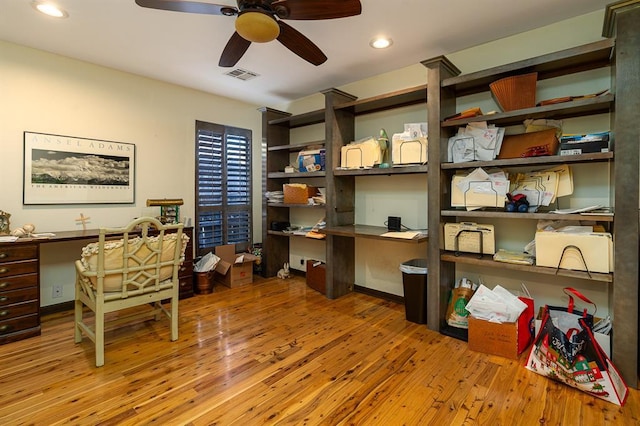 office space with ceiling fan and light hardwood / wood-style floors