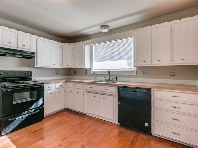 kitchen featuring black appliances, light hardwood / wood-style floors, white cabinets, and sink