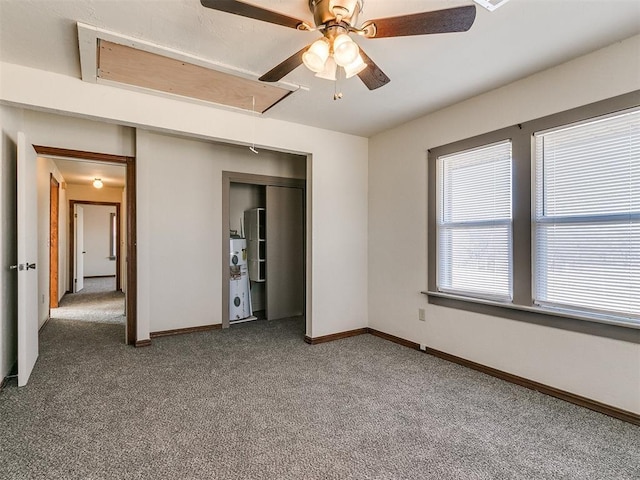 unfurnished bedroom with a closet, carpet floors, and ceiling fan