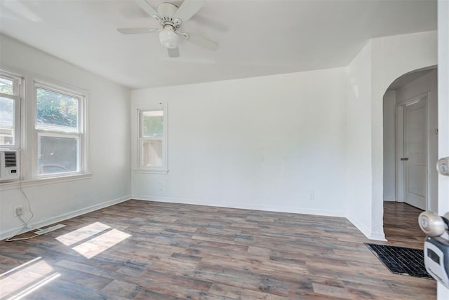 spare room featuring ceiling fan and dark hardwood / wood-style flooring