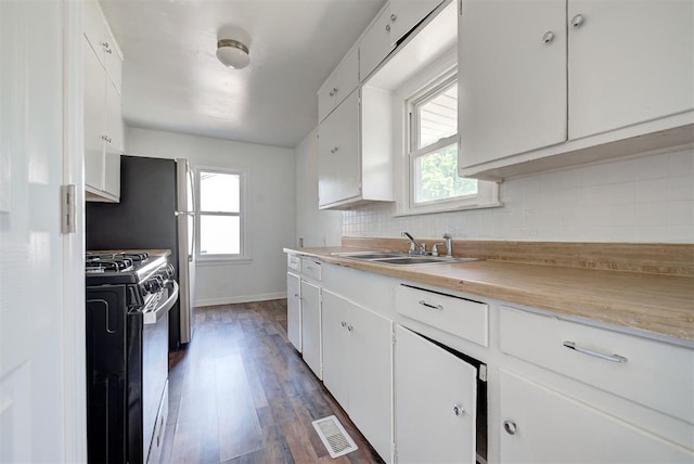 kitchen with range with gas cooktop, white cabinets, dark hardwood / wood-style flooring, and sink