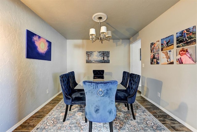 dining space featuring an inviting chandelier