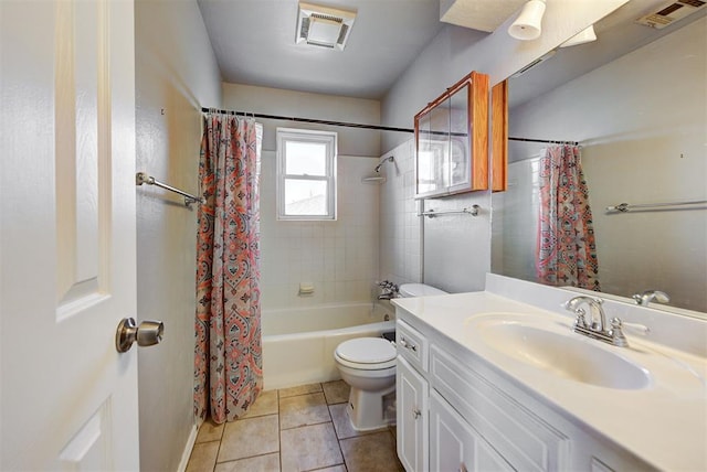 full bathroom with tile patterned flooring, vanity, shower / tub combo, and toilet