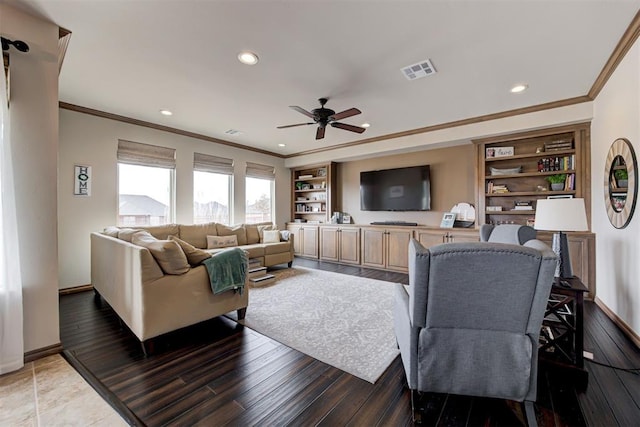 living area featuring visible vents, ornamental molding, a ceiling fan, and recessed lighting