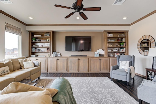living area featuring crown molding, a ceiling fan, visible vents, and dark wood-style flooring