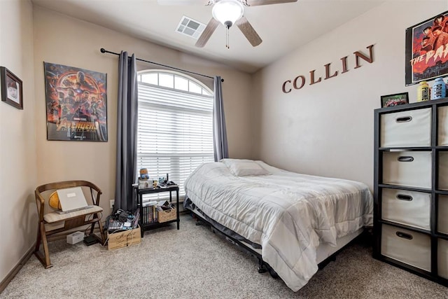 bedroom with baseboards, ceiling fan, carpet flooring, and visible vents