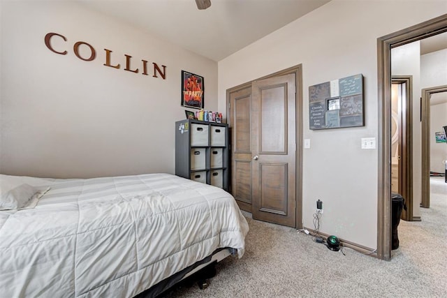 bedroom featuring baseboards, a ceiling fan, and light carpet