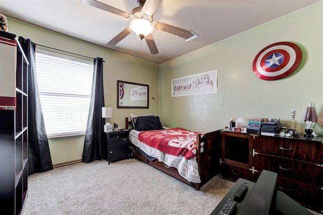 bedroom featuring carpet floors, baseboards, and ceiling fan