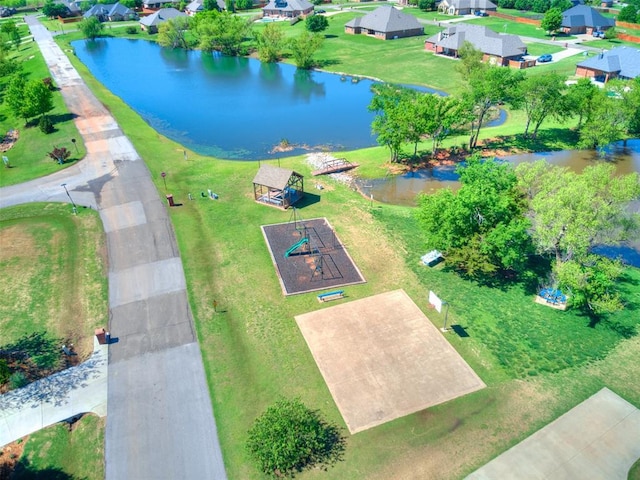 bird's eye view with a water view and a residential view