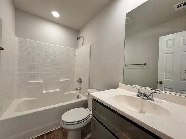 full bathroom with vanity, shower / bathtub combination, toilet, and wood-type flooring