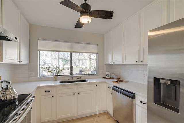 kitchen with stainless steel appliances and white cabinets