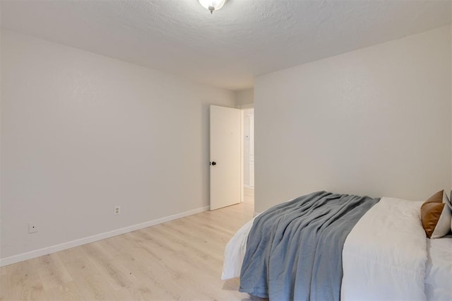 bedroom featuring light wood-type flooring