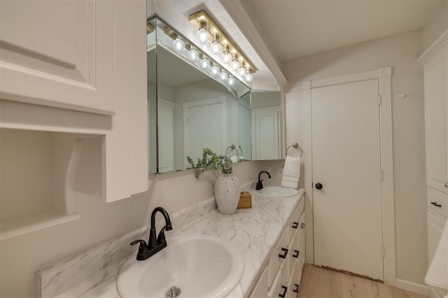 bathroom with vanity and hardwood / wood-style floors