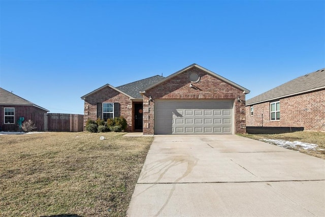 view of front of home with a garage and a front yard