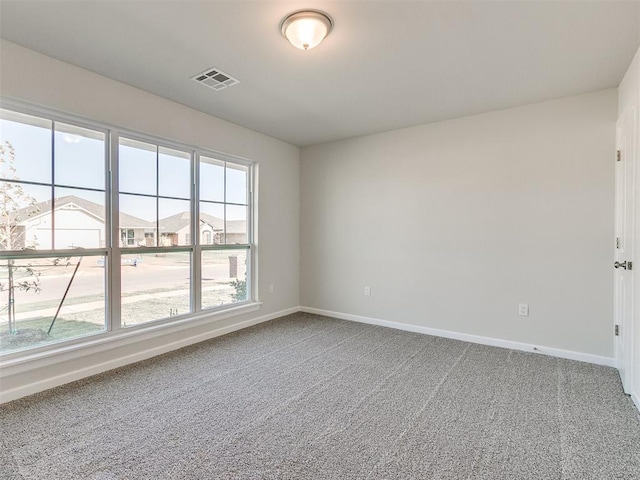 unfurnished room featuring carpet flooring