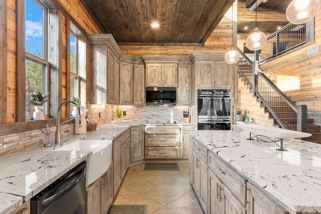 kitchen featuring wood ceiling, appliances with stainless steel finishes, light brown cabinets, decorative light fixtures, and light stone countertops