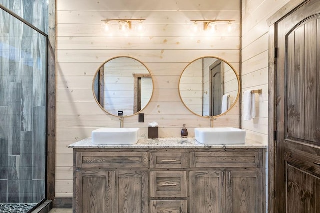 bathroom with vanity and wooden walls