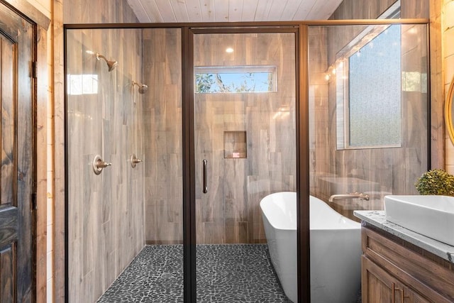 bathroom with wooden ceiling, vanity, and shower with separate bathtub