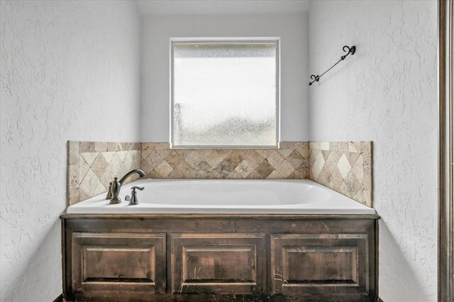 bathroom featuring a washtub