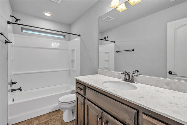 full bathroom featuring vanity, shower / bathing tub combination, tile patterned floors, and toilet