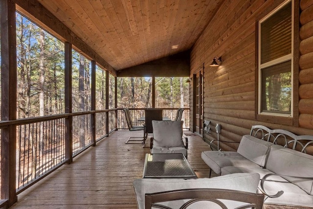 unfurnished sunroom with vaulted ceiling and wood ceiling