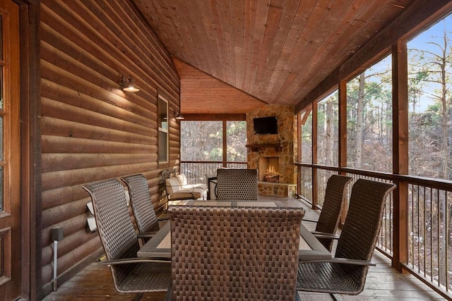 unfurnished sunroom with vaulted ceiling and wood ceiling