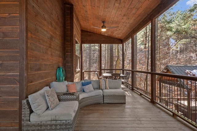 unfurnished sunroom featuring ceiling fan, lofted ceiling, and wood ceiling