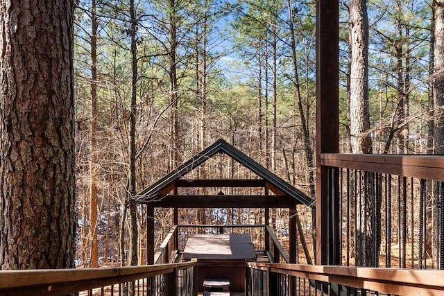 wooden deck with a grill