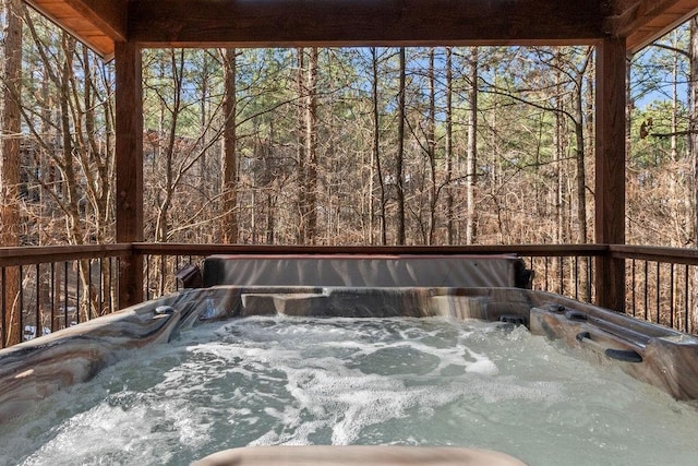 deck featuring a hot tub