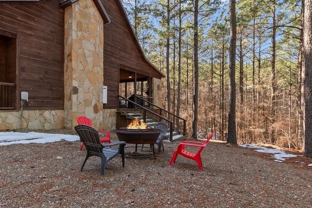 view of yard with a fire pit