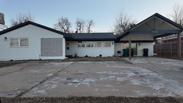 rear view of property with a carport